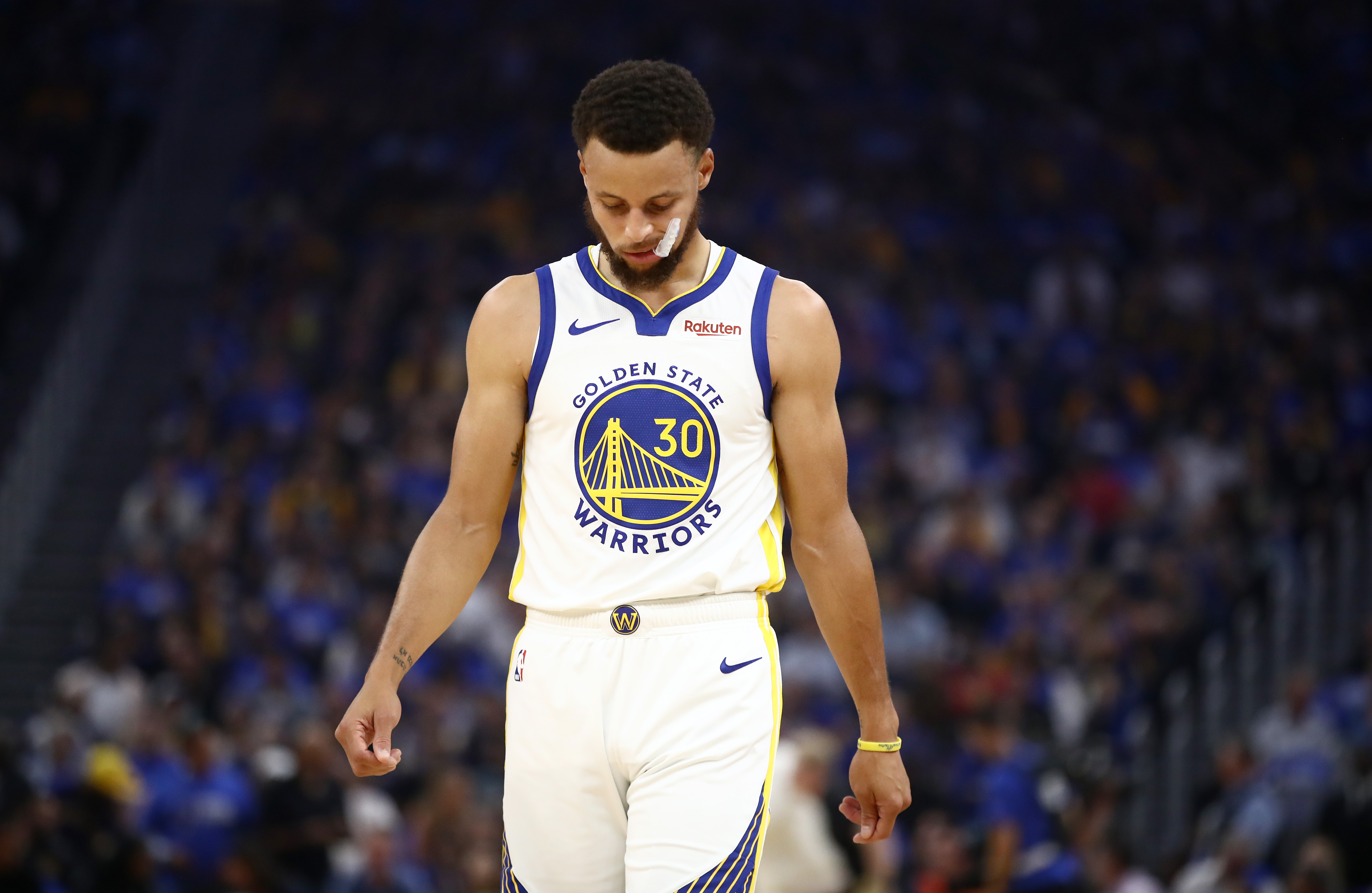 Stephen Curry suffered a broken left hand against the Suns. (Ezra Shaw/Getty Images)