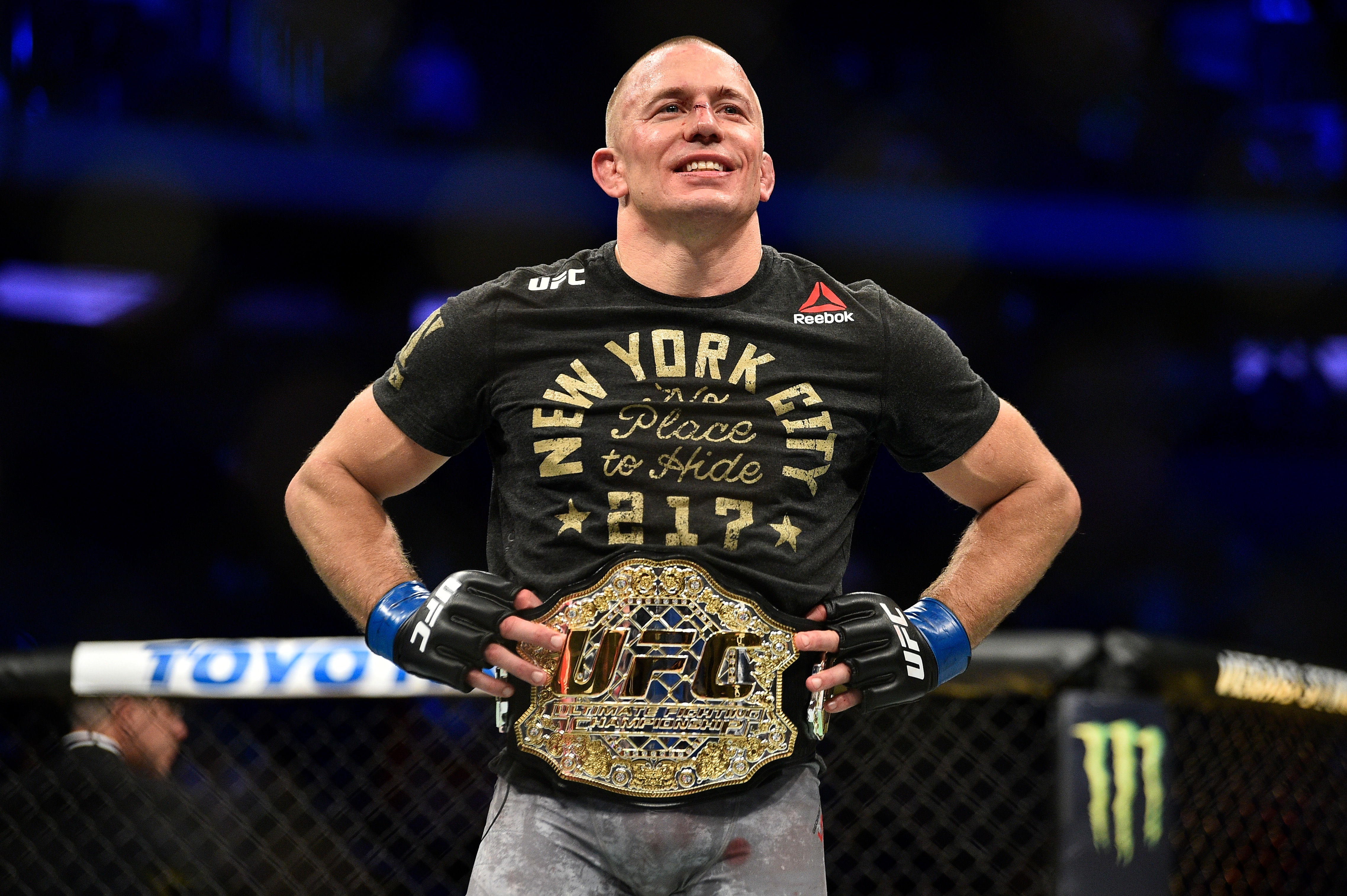 NEW YORK, NY - NOVEMBER 04:  Georges St-Pierre of Canada celebrates after defeating Michael Bisping of England in their UFC middleweight championship bout during the UFC 217 event inside Madison Square Garden on November 4, 2017 in New York City. (Photo by Jeff Bottari/Zuffa LLC/Zuffa LLC via Getty Images)