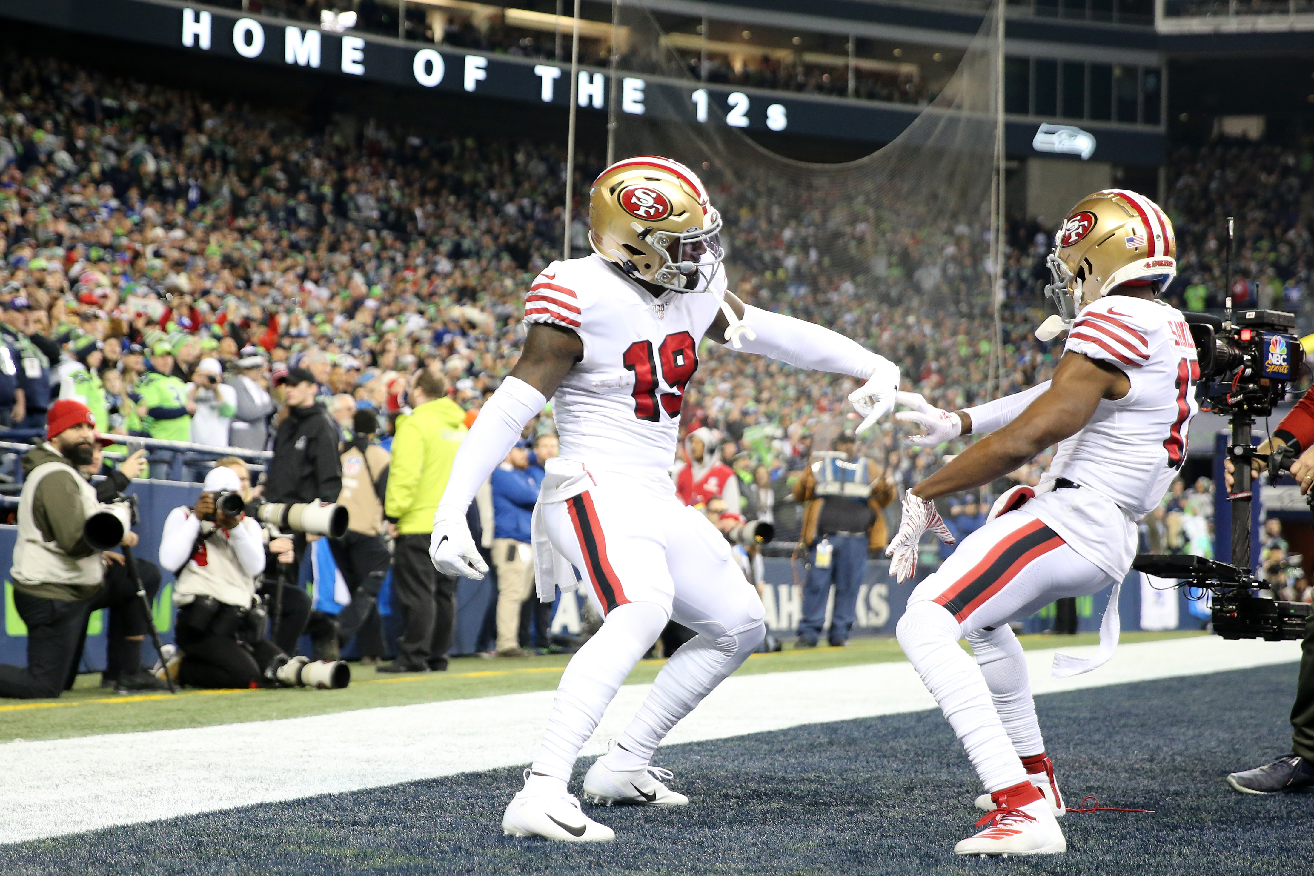 Wide receiver Deebo Samuel (19) of the San Francisco 49ers celebrates his touchdown with Emmanuel Sanders. (Photo by Abbie Parr/Getty Images)
