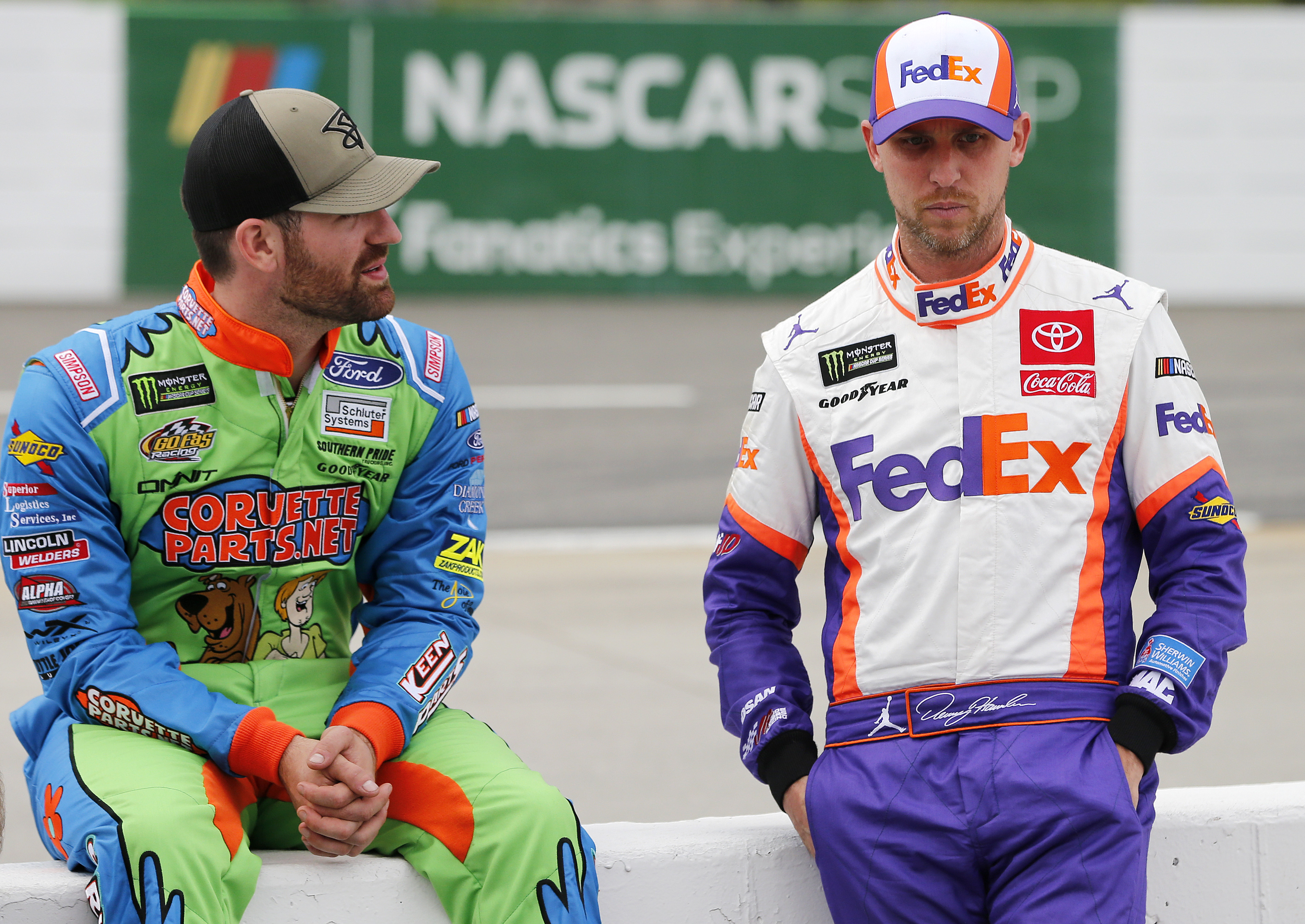 MARTINSVILLE, VIRGINIA - OCTOBER 26: Corey LaJoie, driver of the #32 CorvetteParts.net Ford, talks with Denny Hamlin, driver of the #11 FedEx Freight Toyota, during qualifying for the Monster Energy NASCAR Cup Series First Data 500 at Martinsville Speedway on October 26, 2019 in Martinsville, Virginia. (Photo by Brian Lawdermilk/Getty Images)