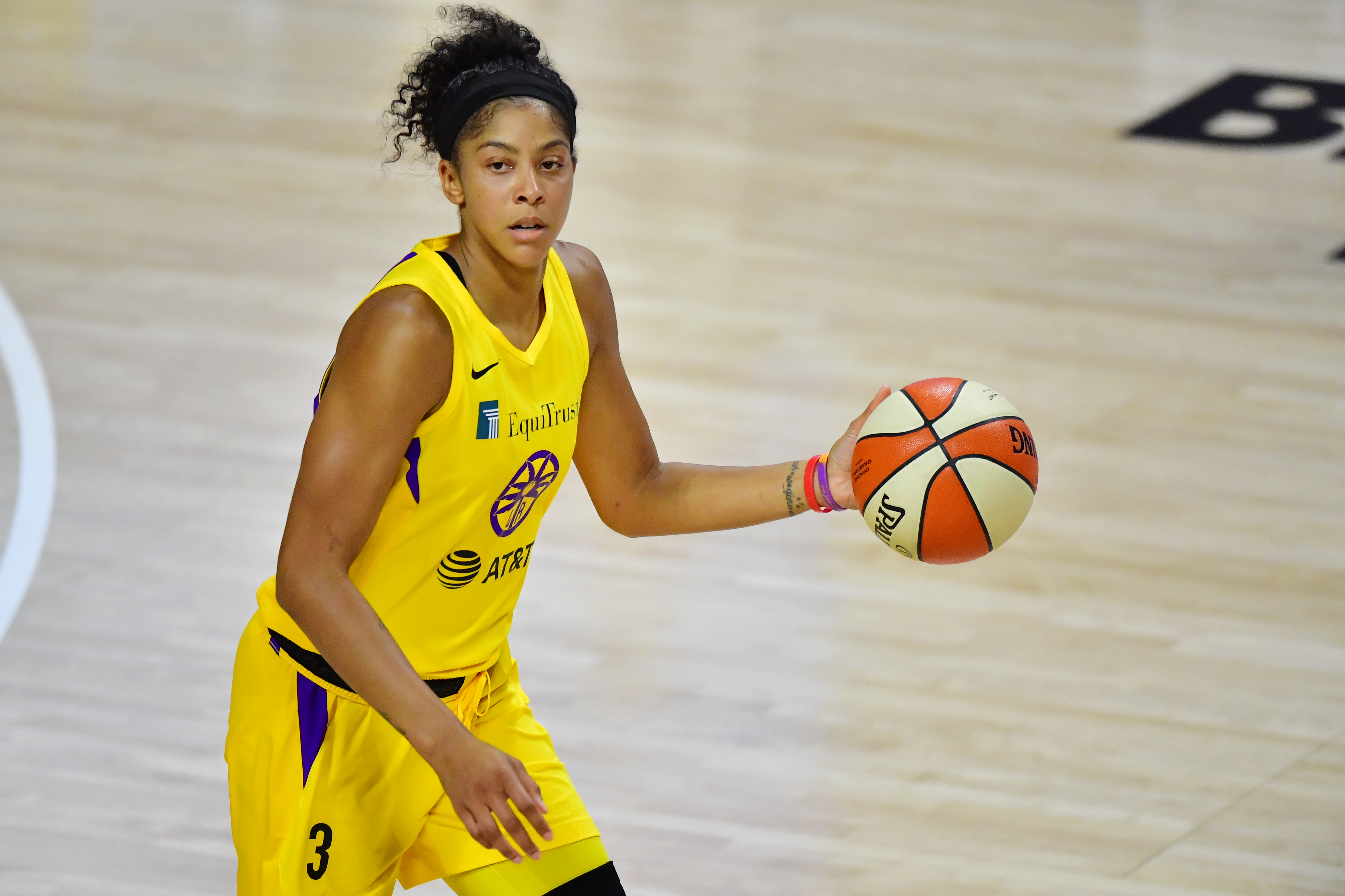 Candace Parker, with ball, on the court. 