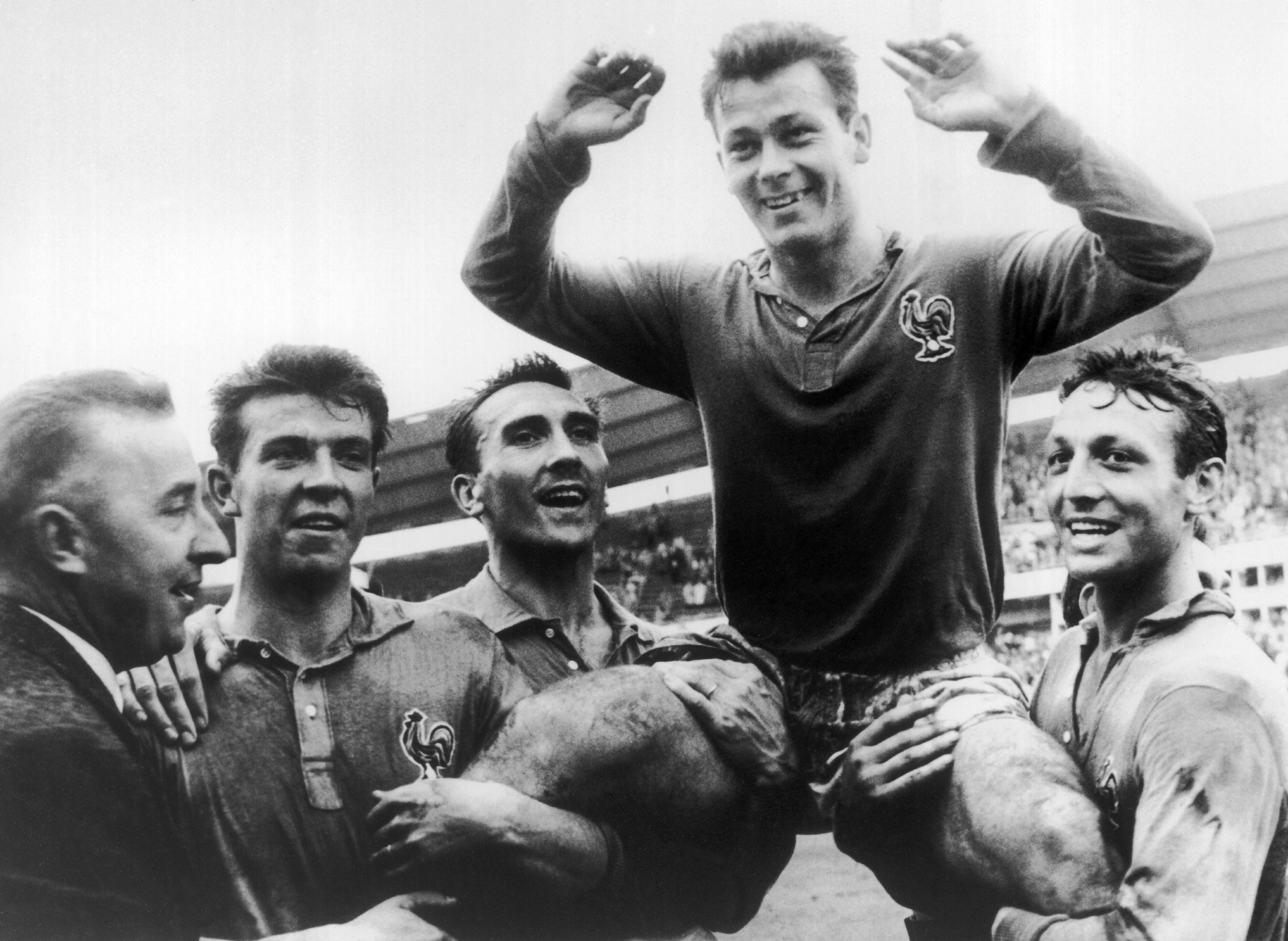 SWEDEN - JUNE 29:  The French player Just FONTAINE who scored 13 goals is held in triumph by his team mates. From left to right : DOUIS, Andre LEROND, Just FONTAINE and Jean VINCENT. France was in the third rank in the World Cup that took place in Stockholm.  (Photo by Keystone-France/Gamma-Keystone via Getty Images)