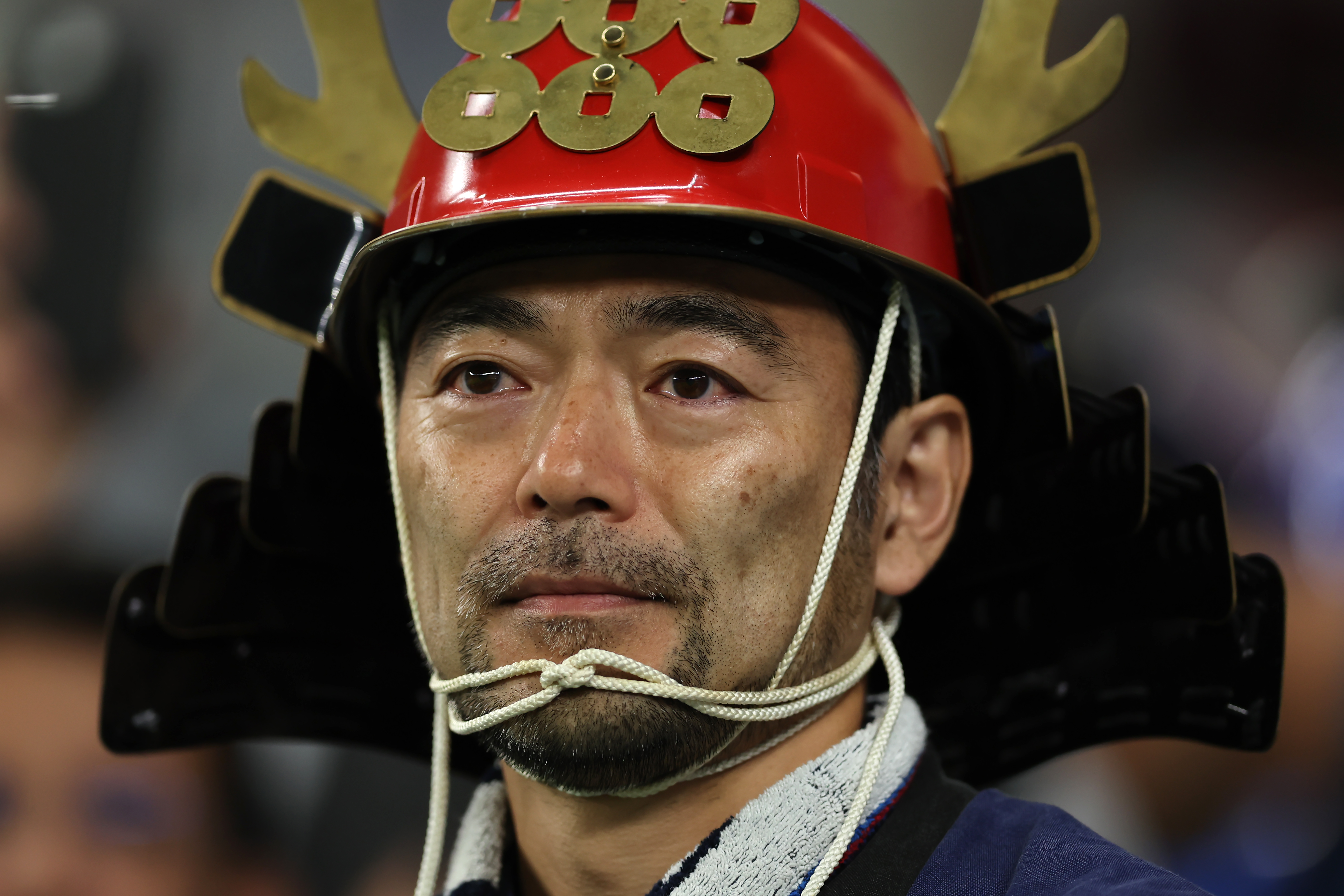 AL WAKRAH, QATAR - DECEMBER 05: A Japan fan reacts following the penalty shoot out defeat in the FIFA World Cup Qatar 2022 Round of 16 match between Japan and Croatia at Al Janoub Stadium on December 05, 2022 in Al Wakrah, Qatar. (Photo by Youssef Loulidi/Fantasista/Getty Images)