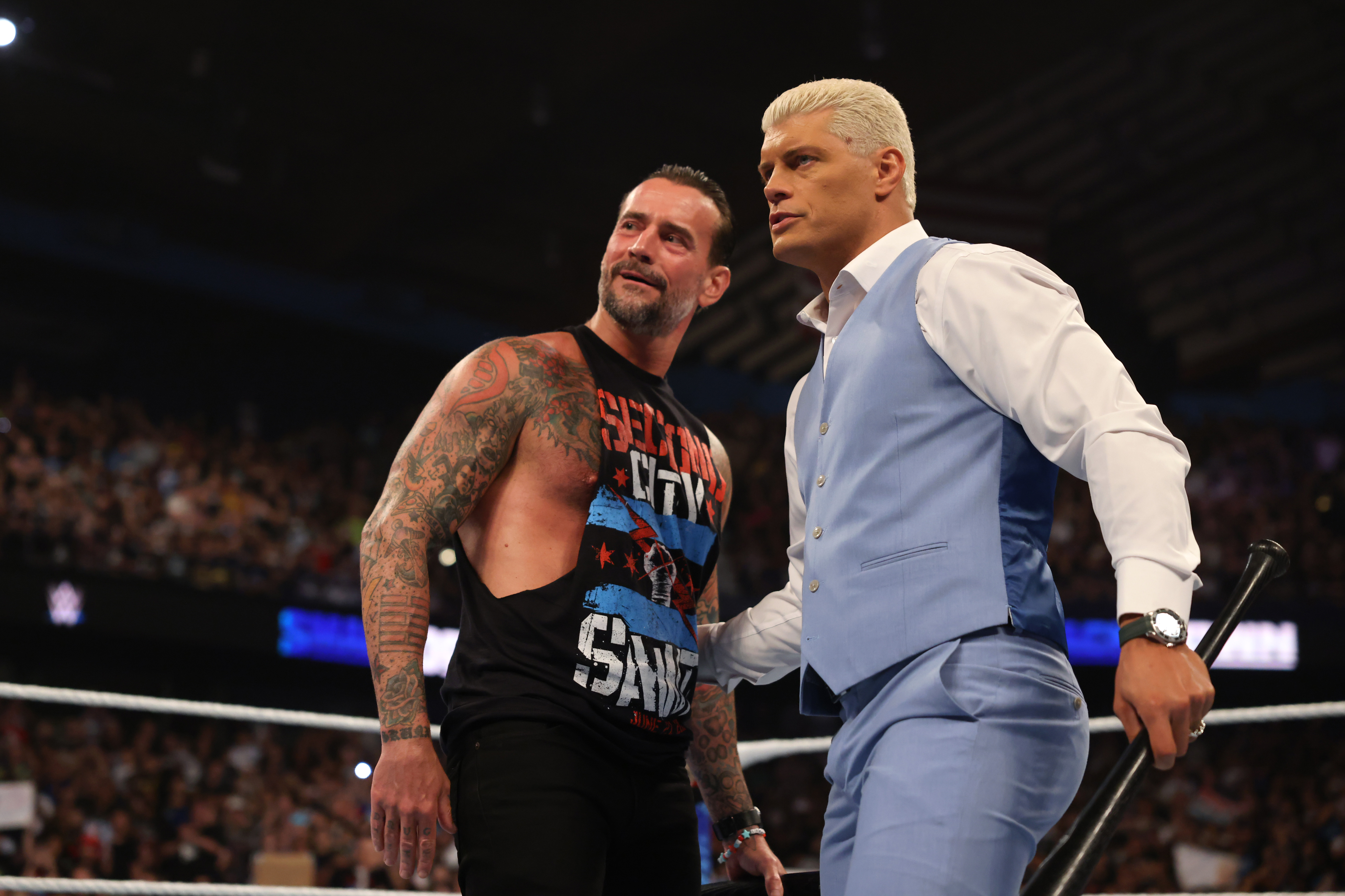 ROSEMONT, ILLINOIS - JUNE 21: WWE Undisputed Champion Cody Rhodes (R) and CM Punk confront Solo Sikoa, Tama Tonga and Tonga Loa (not pictured) of the Bloodline during WWE SmackDown at Allstate Arena on June 21, 2024 in Rosemont, Illinois.  (Photo by WWE/Getty Images)