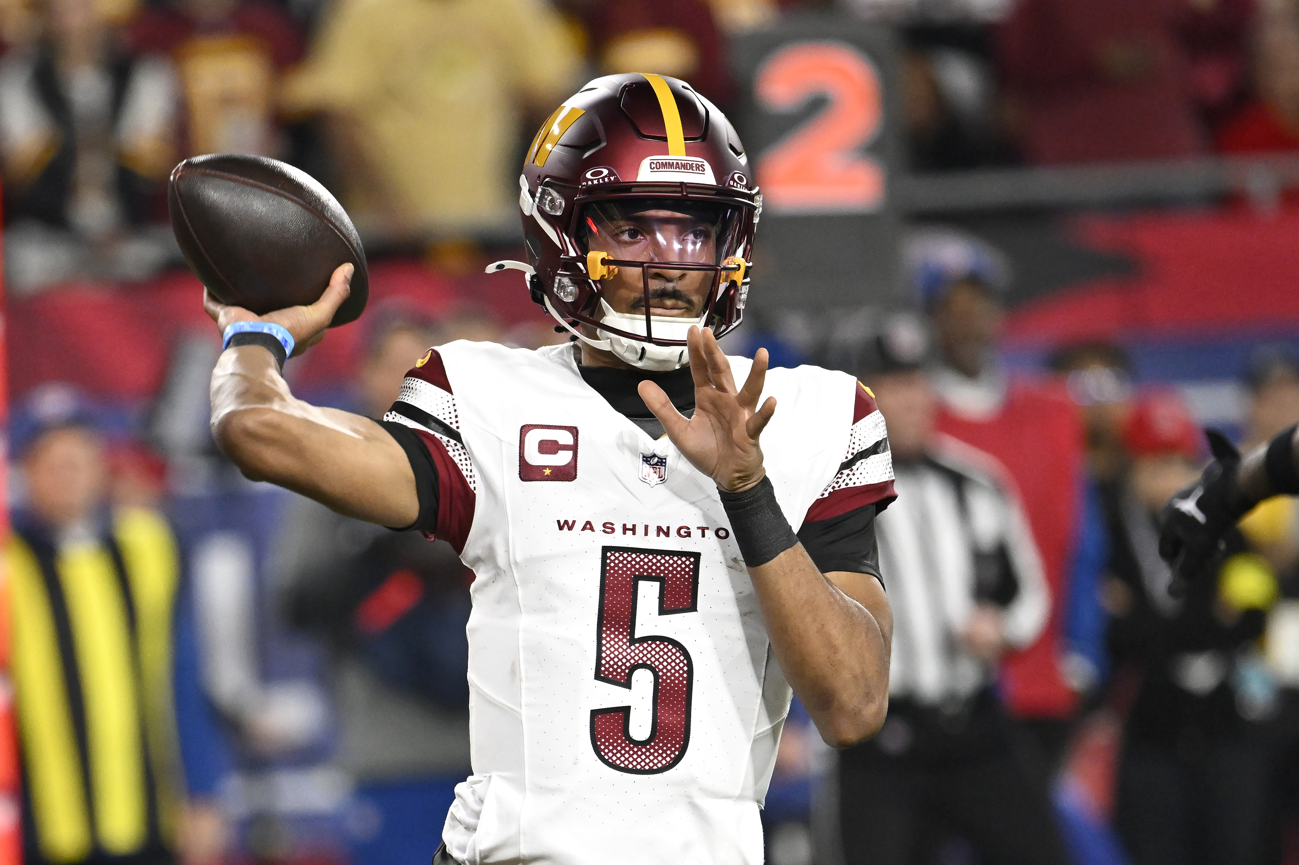Washington Commanders quarterback Jayden Daniels (5) passes against the Tampa Bay Buccaneers during the first half of an NFL wild-card playoff football game in Tampa, Fla., Sunday, Jan. 12, 2025. (AP Photo/Jason Behnken)