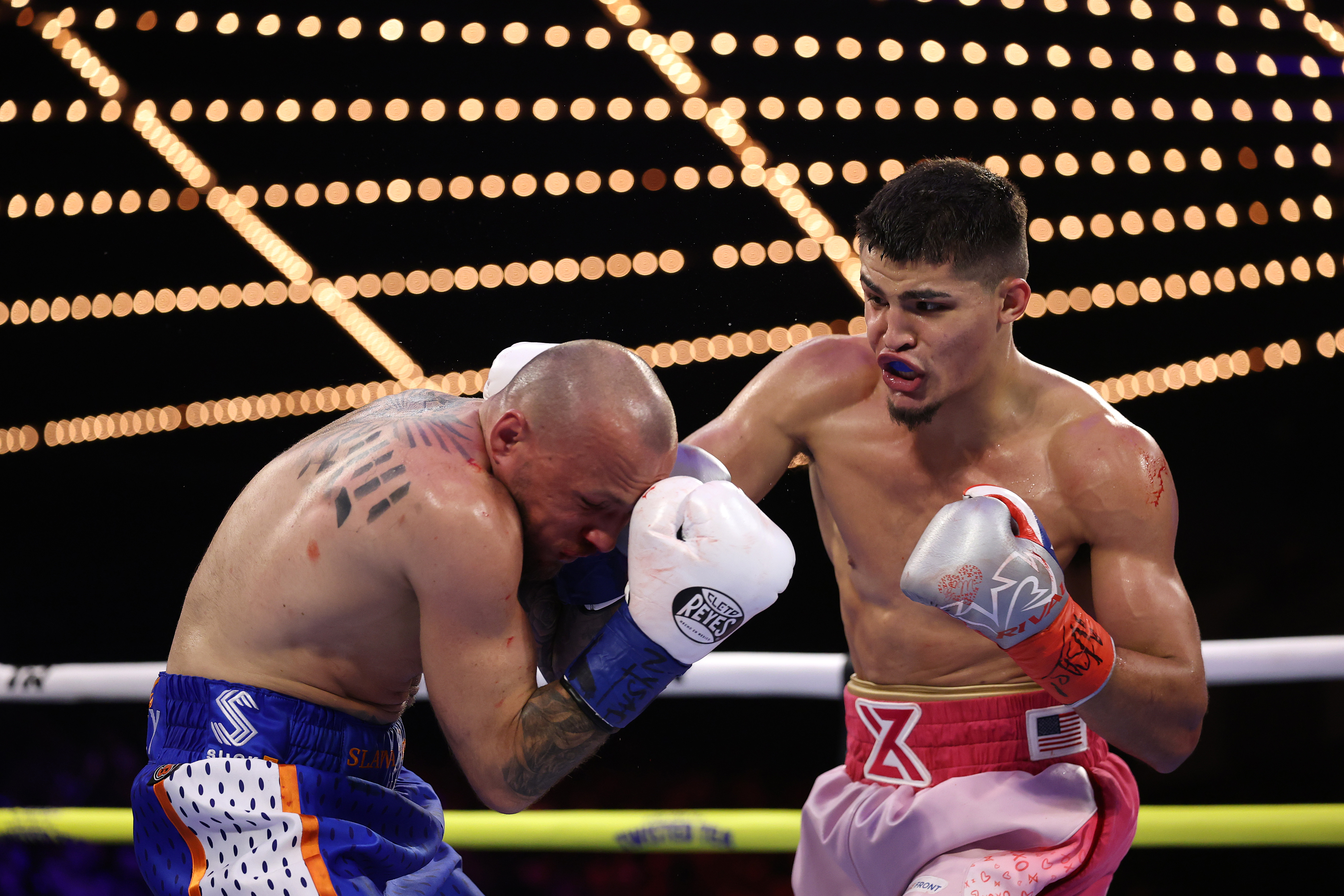 NEW YORK, NEW YORK - FEBRUARY 14:  Xander Zayas punches Slawa Spomer during their junior middleweight fight during their junior bantamweight fight during their lightweight fight during their welterweight fight, during their heavyweight fight at The Theater at Madison Square Garden on February 14, 2025 in New York City. (Photo by Al Bello/Getty Images)