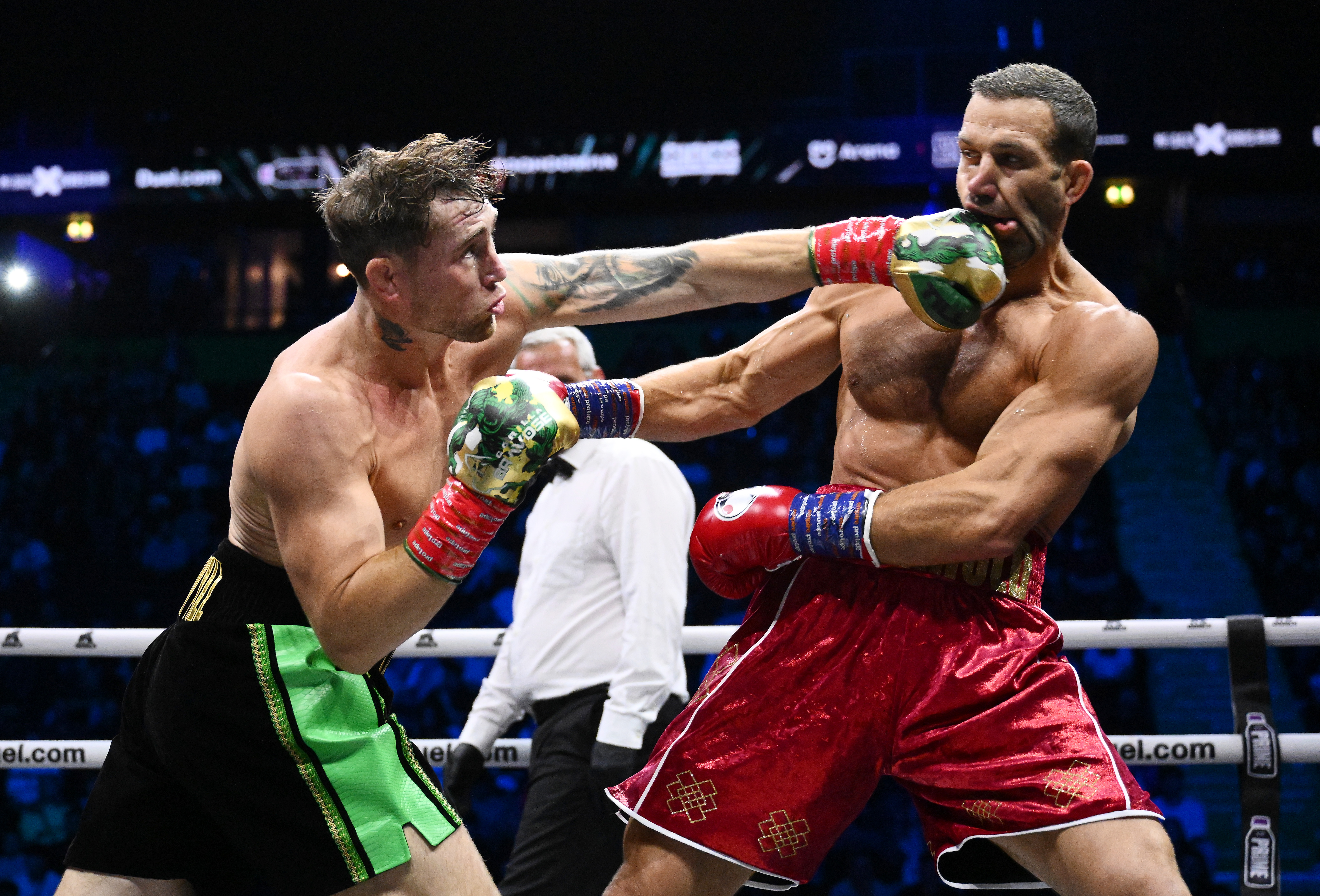 MANCHESTER, ENGLAND - AUGUST 30: Darren Till punches Luke Rockhold during the Light Heavyweight fight between Darren Till and Luke Rockhold during the Misfits 22 - Ring of Thrones fight night at AO Arena on August 30, 2025 in Manchester, England.  (Photo by Ben Roberts Photo/Getty Images)