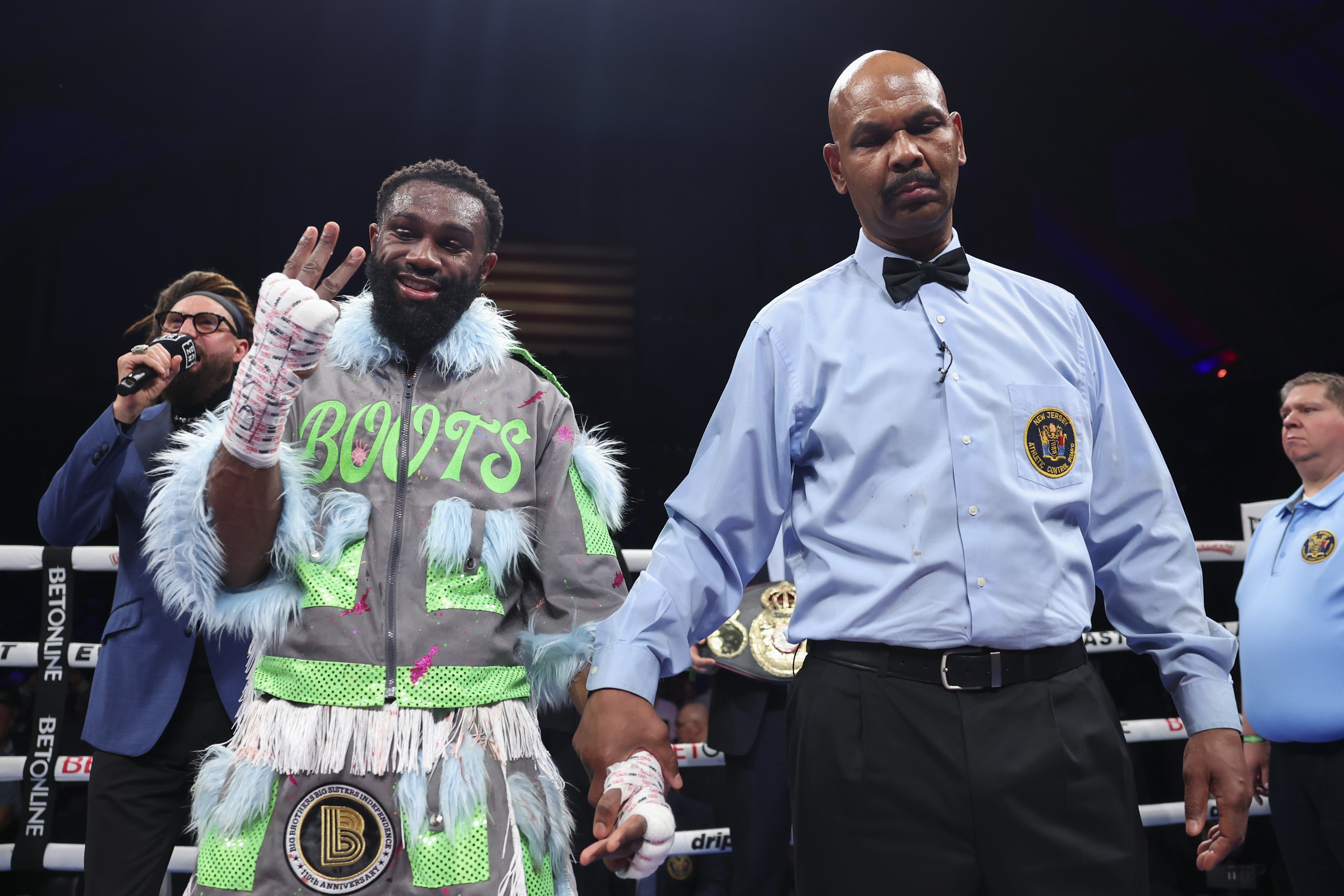 ATLANTIC CITY, NEW JERSEY - APRIL 12: Jaron Ennis (L) reacts after winning his fight against Eimantas Stanionis for the Ring Magazine, IBF world & WBA world welterweight titles at Jim Whelan Boardwalk Hall on April 12, 2025 in Atlantic City, New Jersey. (Photo by Mark Robinson/Matchroom Boxing/Getty Images)
