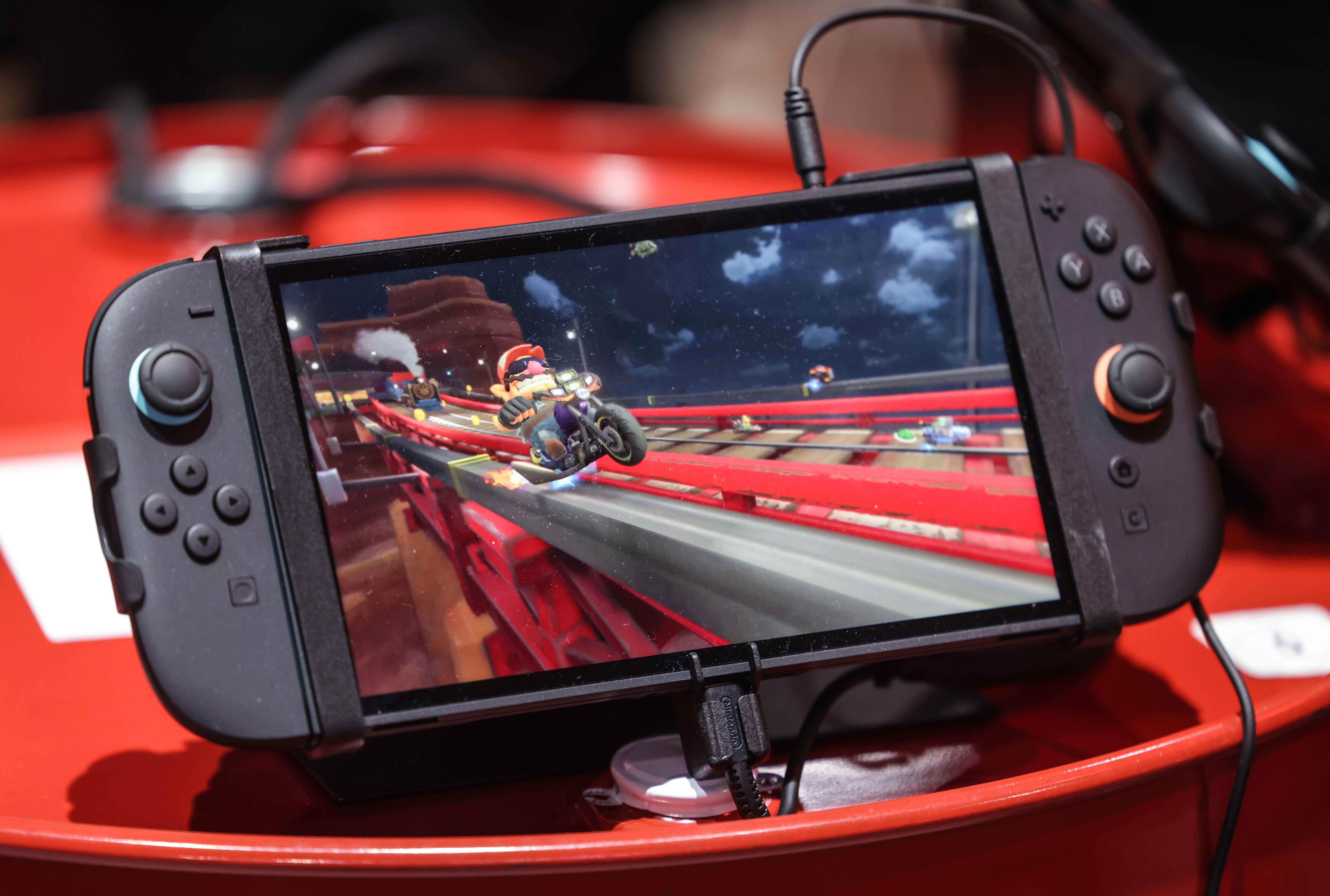 20 August 2025, North Rhine-Westphalia, Cologne: The new Nintendo Switch 2 handheld lies on a box. The computer games fair Gamescom takes place from August 20-24, 2025 in Cologne. Photo: Oliver Berg/dpa (Photo by Oliver Berg/picture alliance via Getty Images)