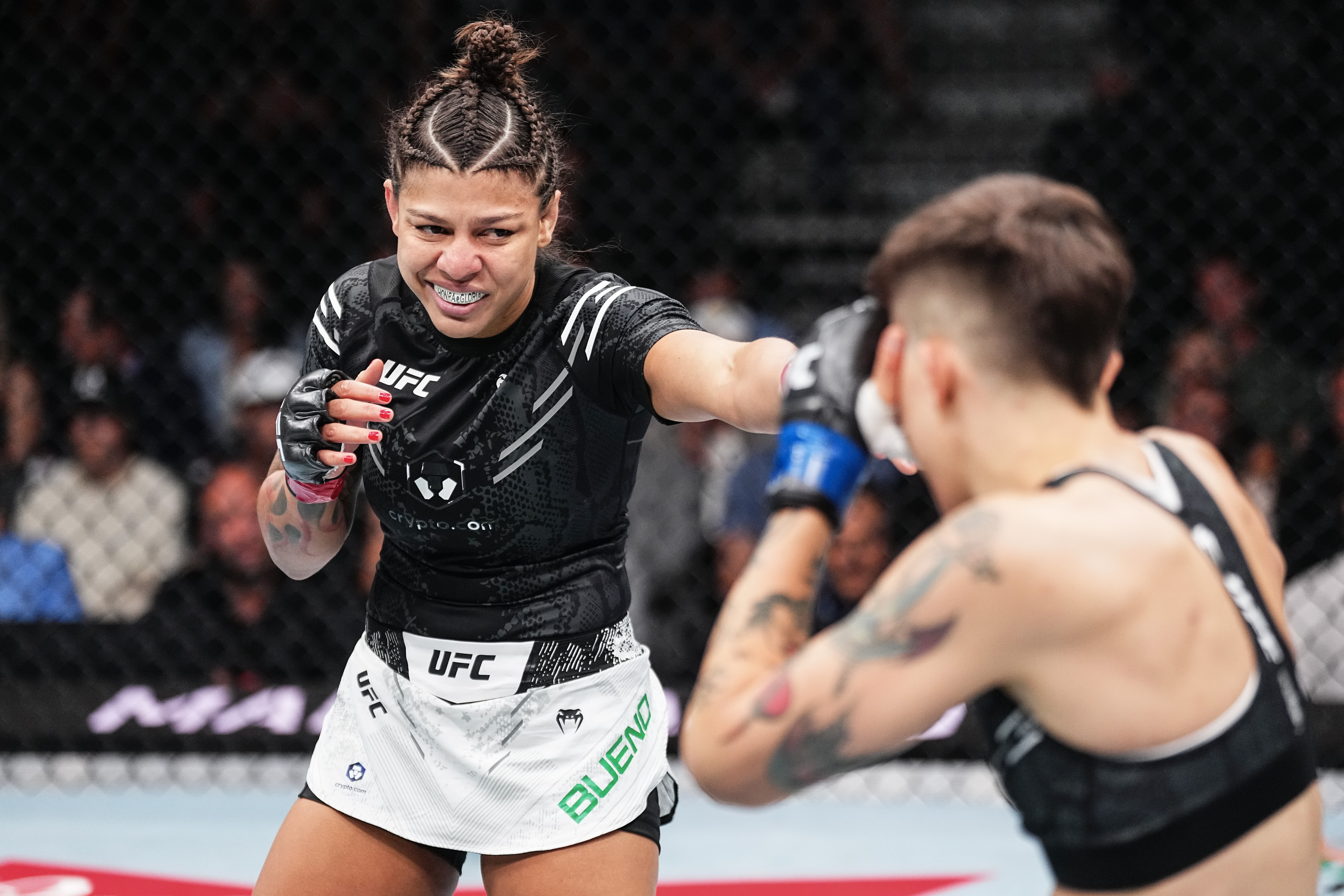 LAS VEGAS, NEVADA - JUNE 29: Mayra Bueno Silva of Brazil punches Macy Chiasson in a bantamweight fight during the UFC 303 event at T-Mobile Arena on June 29, 2024 in Las Vegas, Nevada. (Photo by Jeff Bottari/Zuffa LLC via Getty Images)
