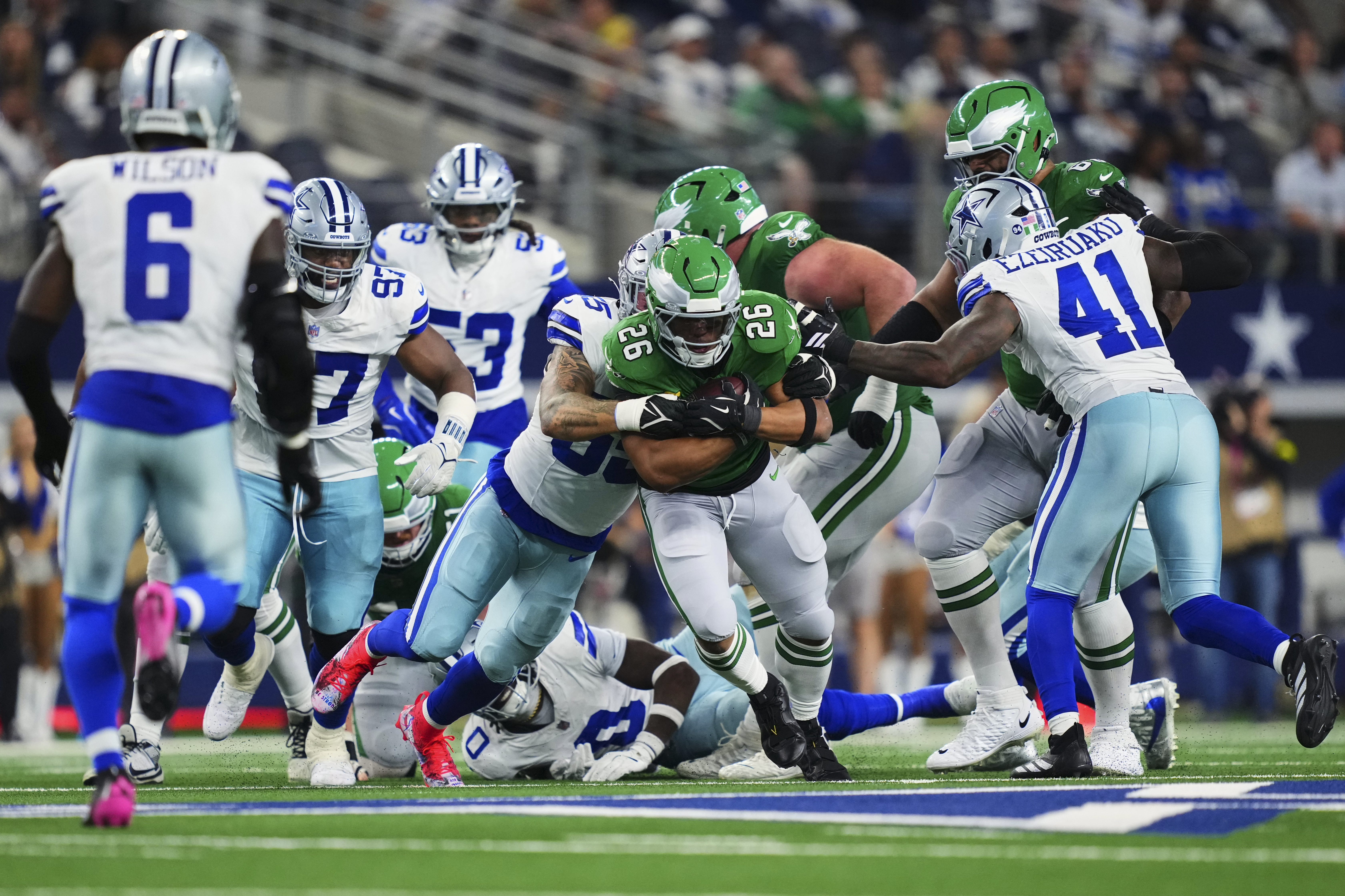 ARLINGTON, TX - NOVEMBER 23: Saquon Barkley #26 of the Philadelphia Eagles carries the ball against the Dallas Cowboys during the second half of an NFL football game at AT&T Stadium on November 23, 2025 in Arlington, Texas. (Photo by Cooper Neill/Getty Images)