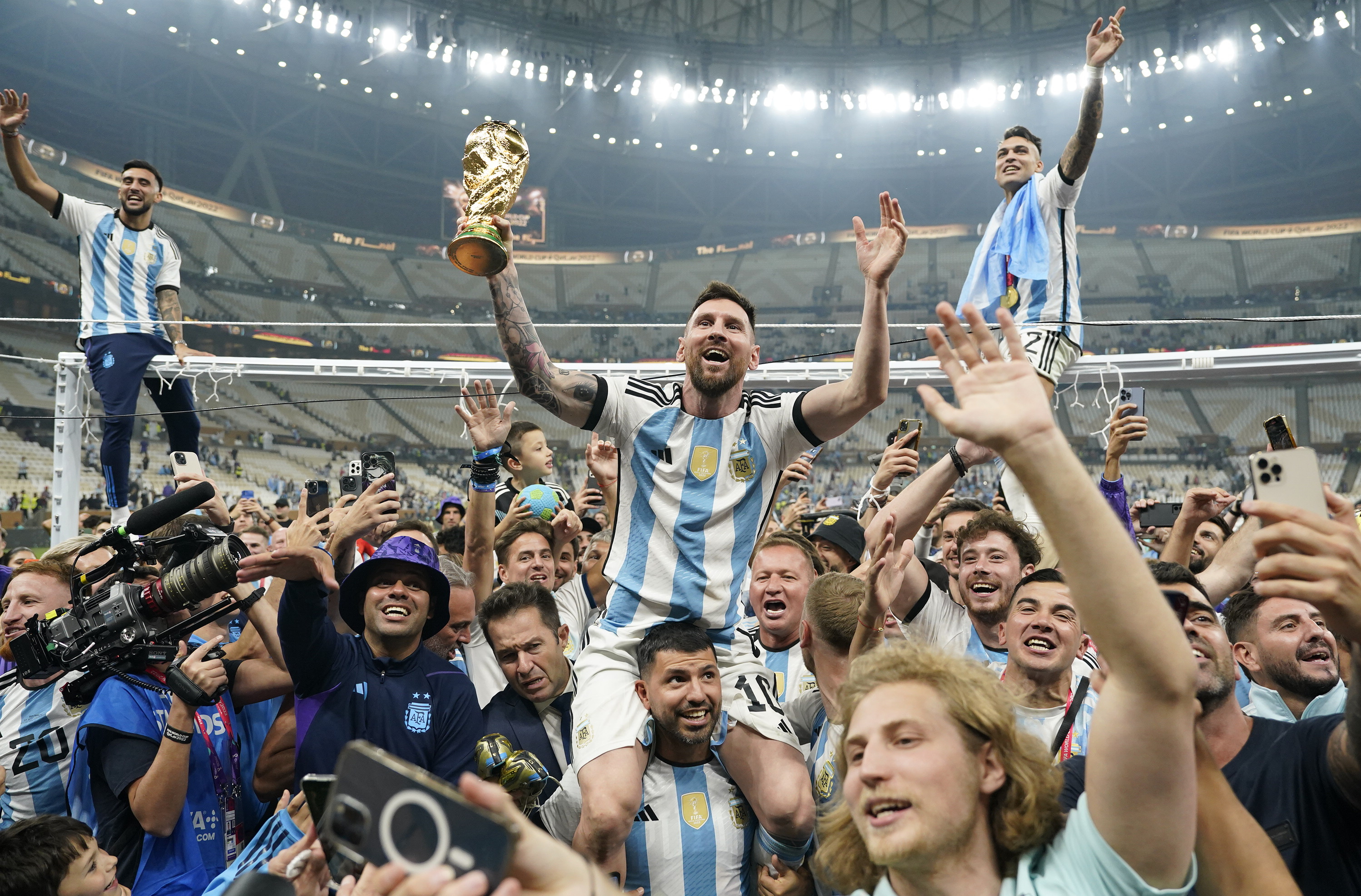 LUSAIL, QATAR - DECEMBER 18: Argentina forward Lionel Messi (10) holds aloft the World Cup trophy after defeating France to win the final match of the FIFA World Cup 2022 between Argentina and France at Lusail Stadium in Lusail, Qatar on December 18, 2022. (Photo by Jabin Botsford/The Washington Post via Getty Images)