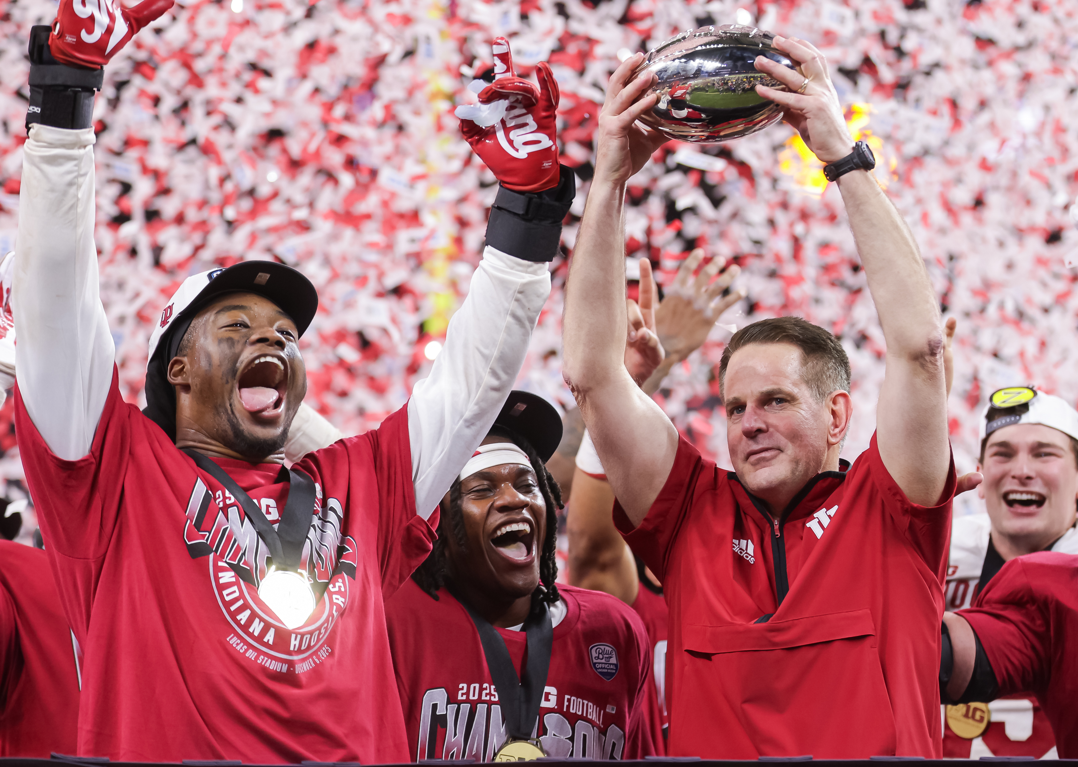 INDIANAPOLIS, INDIANA - DECEMBER 6: Mikail Kamara #6 of the Indiana Hoosiers and head coach Curt Cignetti of the Indiana Hoosiers celebrate after the 2025 Big Ten Championship game against the Ohio State Buckeyes at Lucas Oil Stadium on December 6, 2025 in Indianapolis, Indiana. (Photo by Michael Hickey/Getty Images)