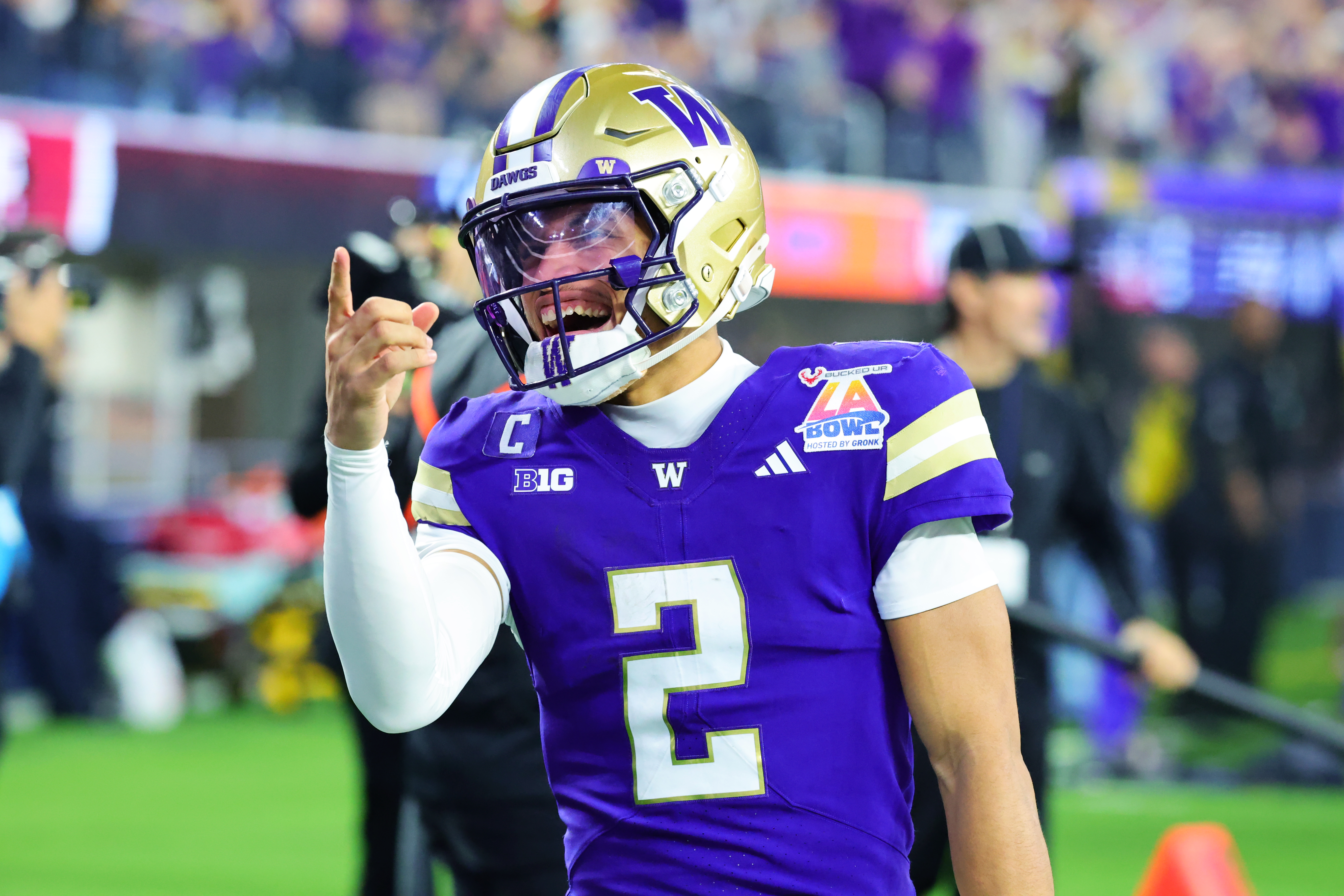 INGLEWOOD, CALIFORNIA - DECEMBER 13: Quarterback Demond Williams Jr. #2 of the Washington Huskies  points up at the fans after throwing a scoring pass during the first half of the LA Bowl Game against the Boise State Broncos at Sofi Stadium on December 13, 2025 in Inglewood, California. (Photo by Kevin Terrell/Getty Images)