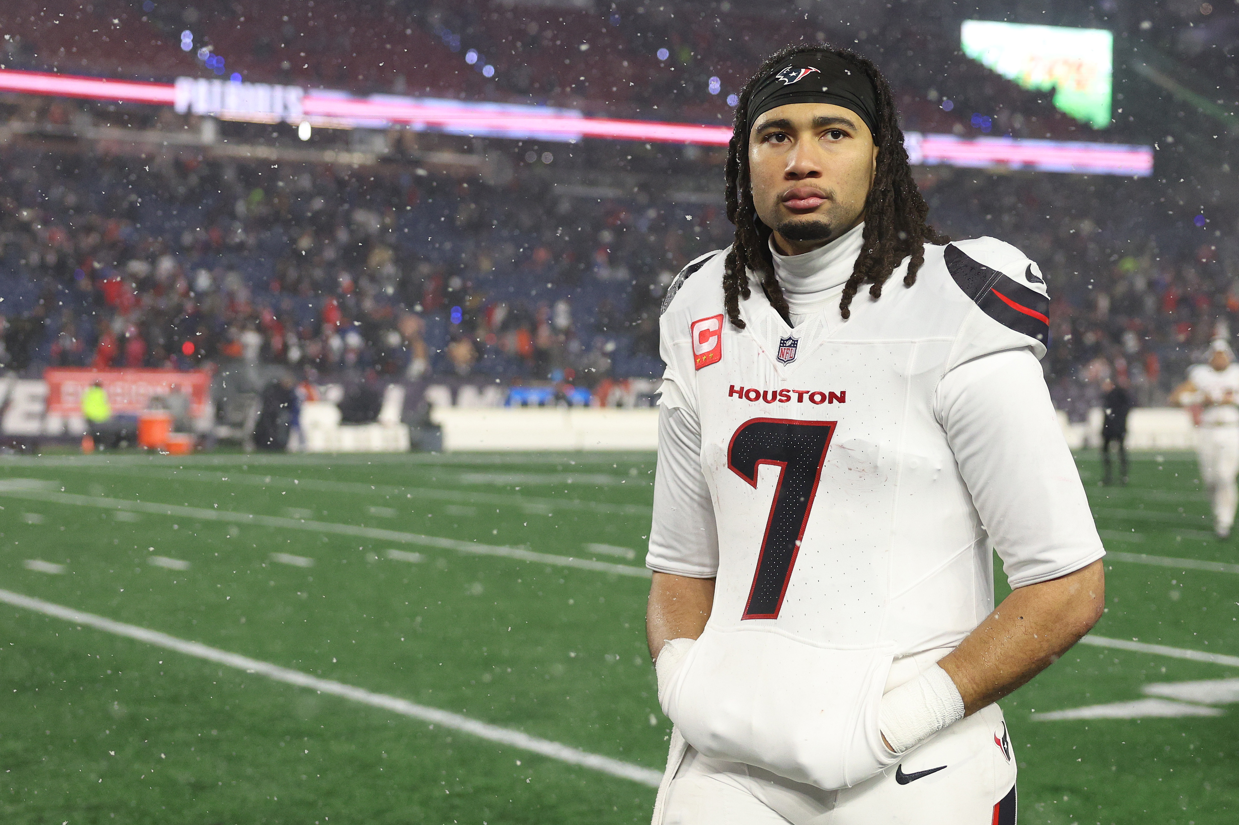C.J. Stroud walks off the field after the Texans' divisional round playoff loss to the Patriots. (Photo by Elsa/Getty Images)