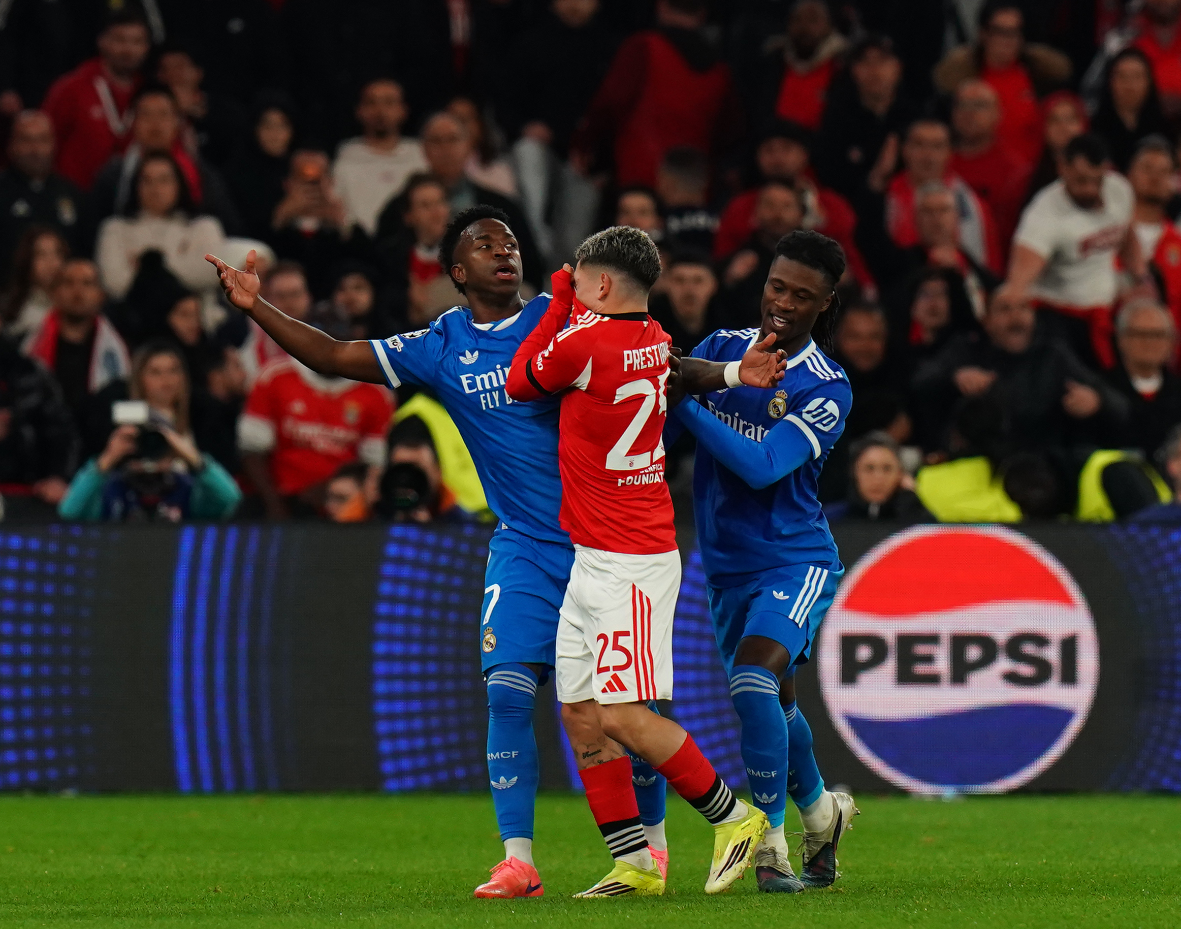 Gianluca Prestianni of SL Benfica confronts with alleged racist comments directed at Goal Scorer Vinicius Junior of Real Madrid C.F. after goal celebrations during the UEFA Champions League 2025/26 League Knockout Play-off First Leg match. (Photo by Gualter Fatia/Getty Images)