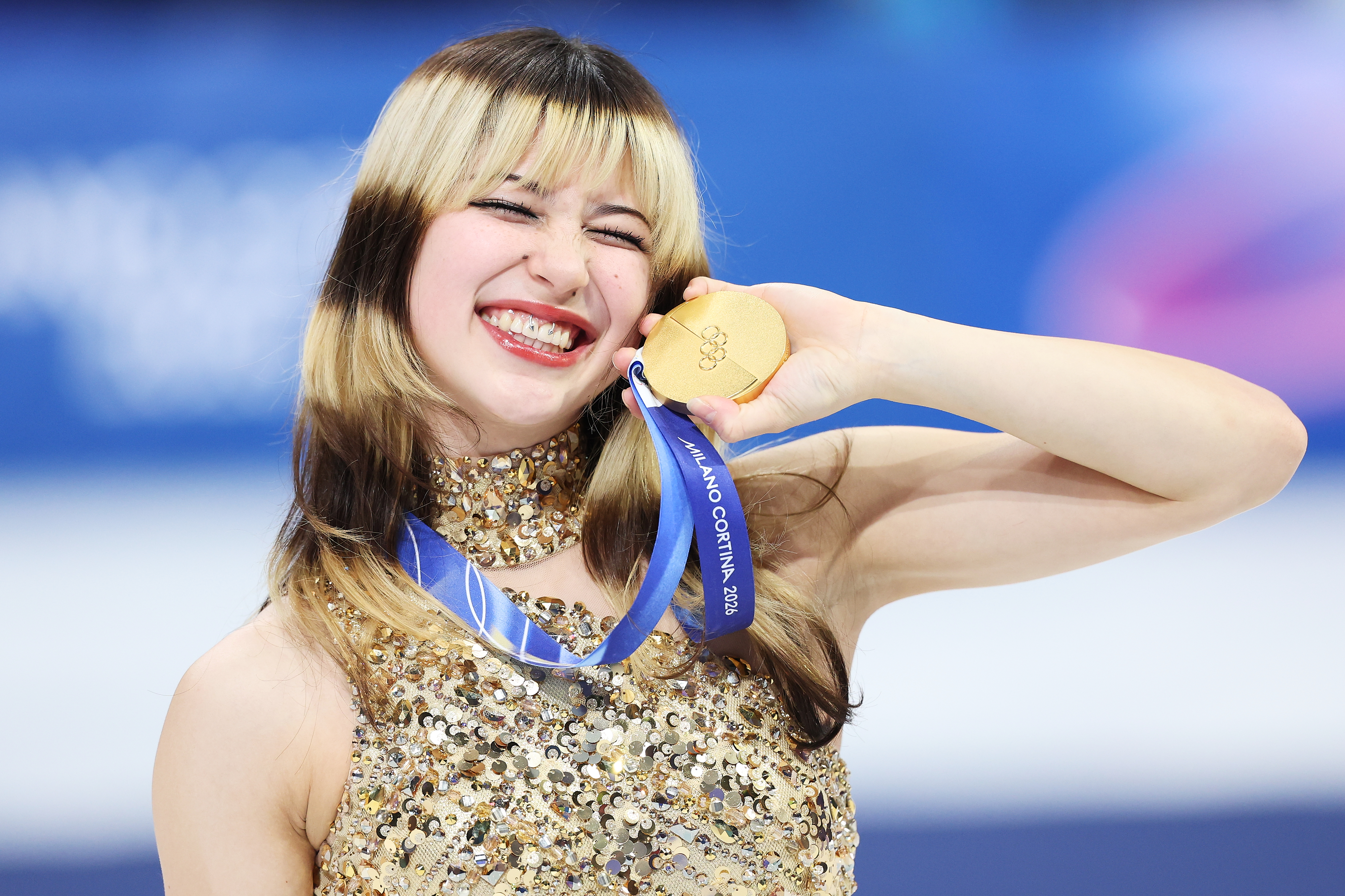 MILAN, ITALY - FEBRUARY 19: Gold medalist Alysa Liu of Team United States celebrates on the podium during the medal ceremony for the Women's Single Skating - Free Skating on day thirteen of the Milano Cortina 2026 Winter Olympics at Milano Ice Skating Arena on February 19, 2026 in Milan, Italy. (Photo by Tang Xinyu/VCG via Getty Images)