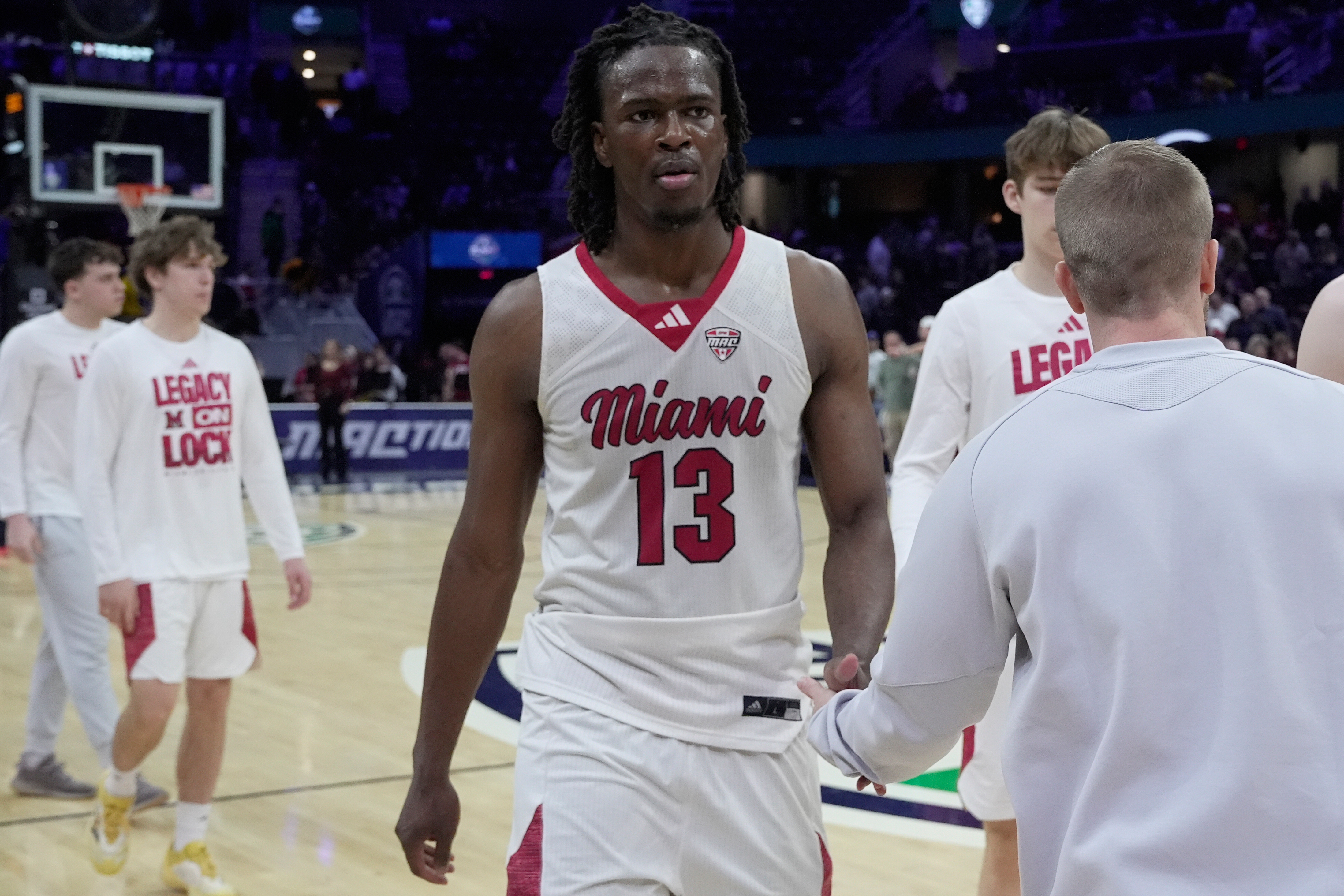 Miami forward Antwone Woolfolk (13) was off the court after Miami was defeated by Massachusetts in a basketball game in the quarterfinals of the Mid-American Conference tournament, Thursday, March 12, 2026, in Cleveland. (AP Photo/Sue Ogrocki)