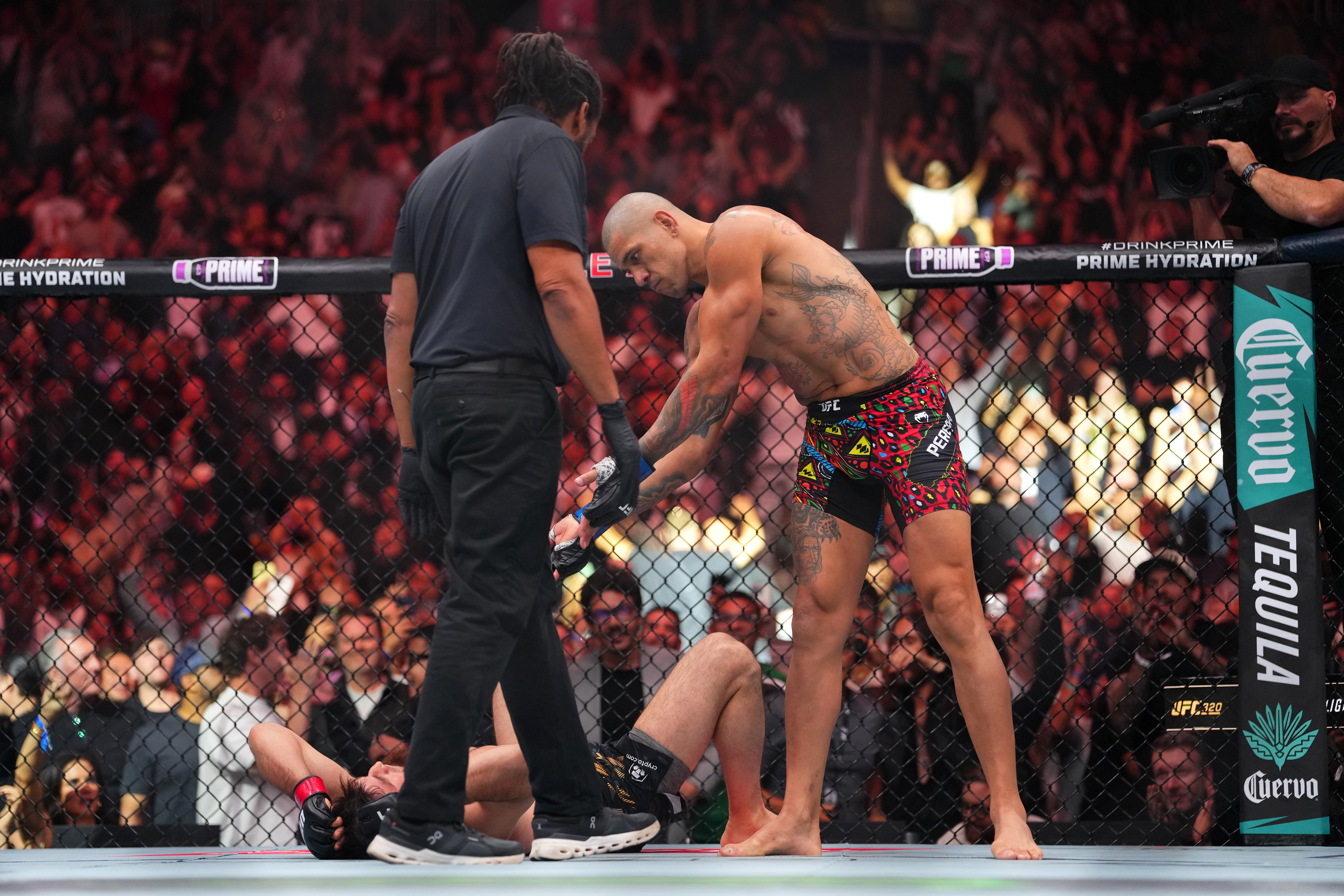 LAS VEGAS, NEVADA - OCTOBER 04:  (R-L) Alex Pereira of Brazil celebrates his TKO victory over Magomed Ankalaev of Russia in their light heavyweight title fight at T-Mobile Arena on October 04, 2025 in Las Vegas, Nevada. (Photo by Cooper Neill/Zuffa LLC)