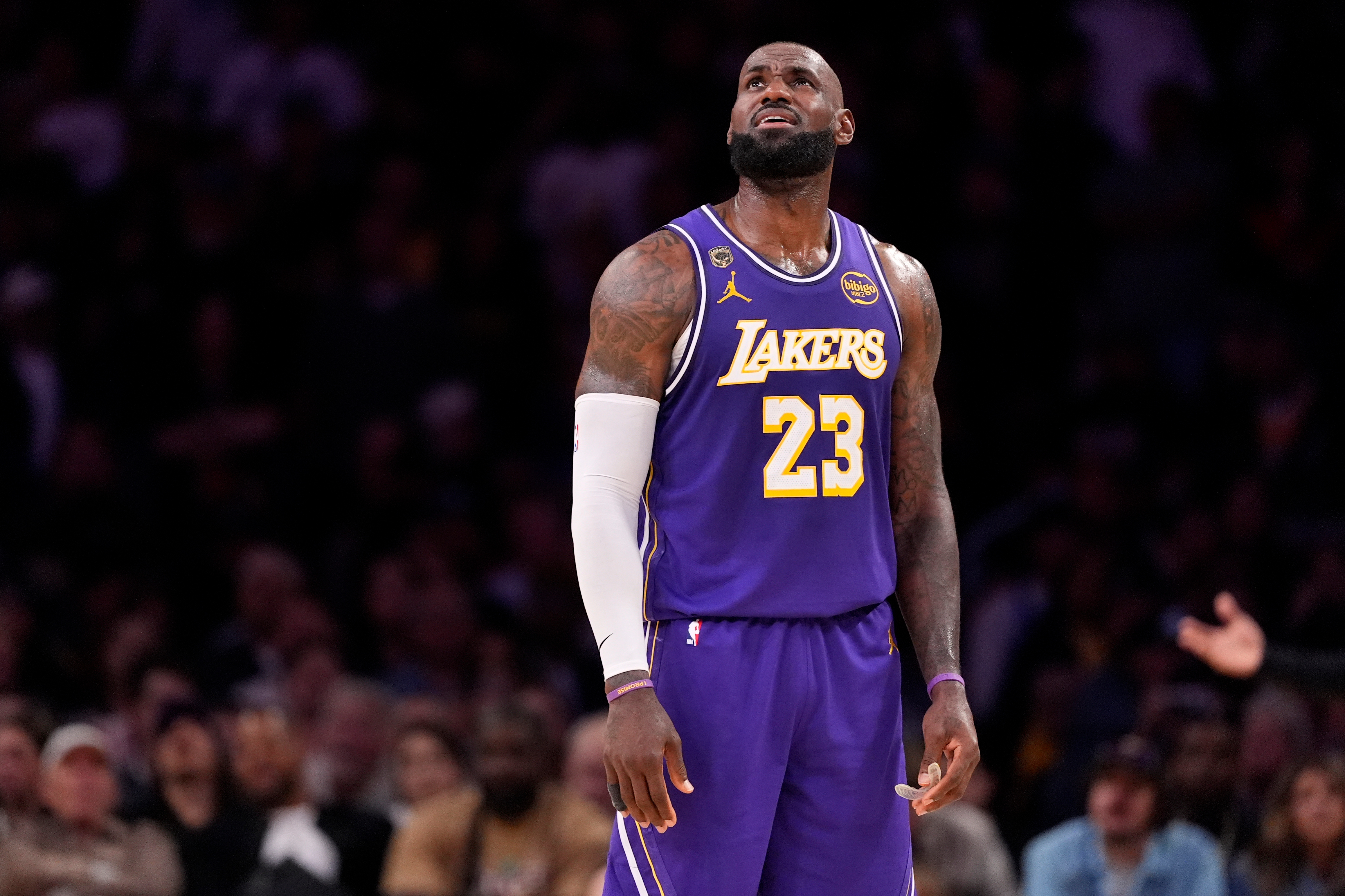 Los Angeles Lakers forward LeBron James looks toward the scoreboard during the second half in Game 5 of a first-round NBA playoffs basketball series against the Houston Rockets, Wednesday, April 29, 2026, in Los Angeles. (AP Photo/Mark J. Terrill)