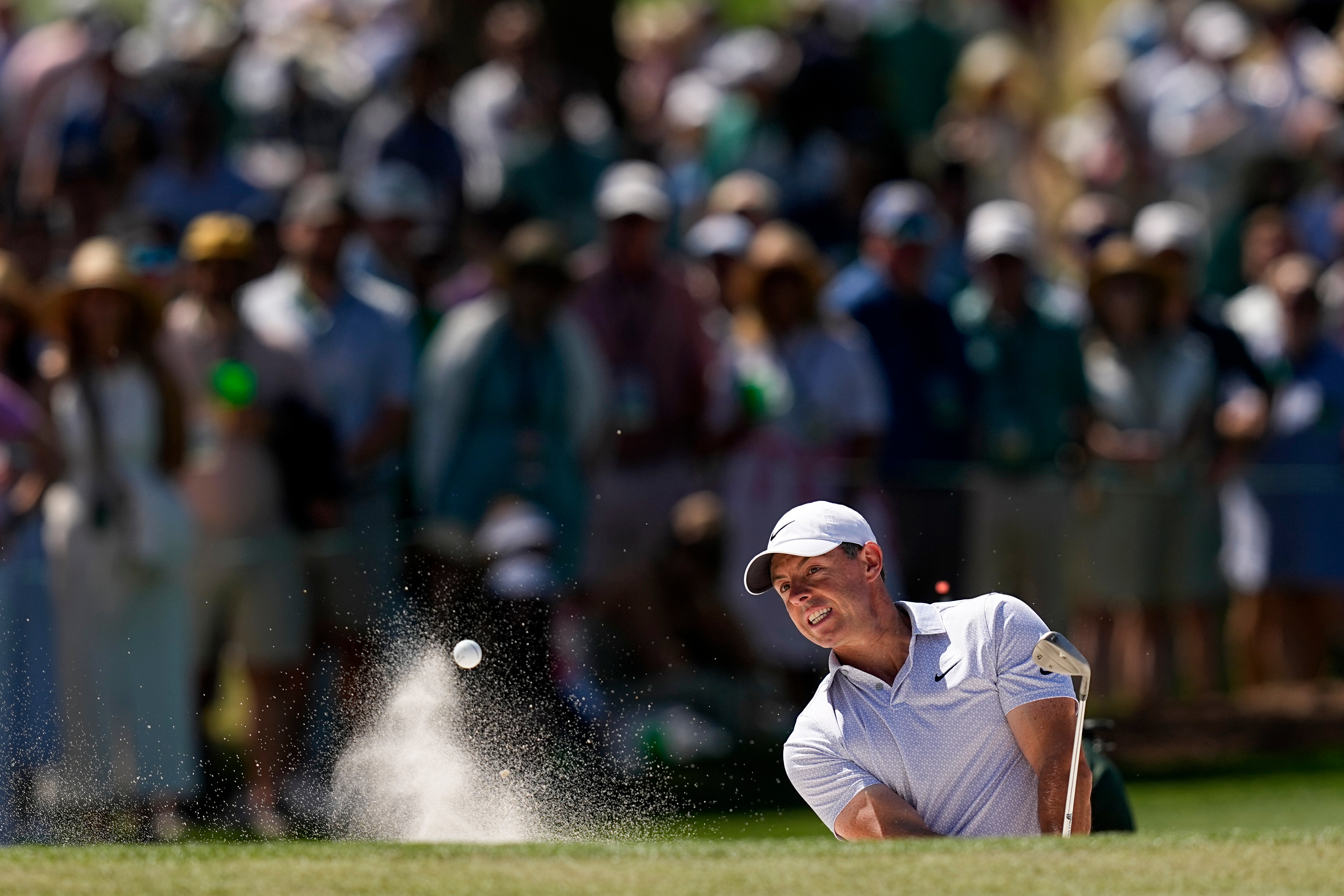 Rory McIlroy, of Northern Ireland, hits from the bunker on the seventh hole during the second round of the Masters golf tournament at the Augusta National Golf Club, Friday, April 10, 2026, in Augusta, Ga. (AP Photo/David J. Phillip)