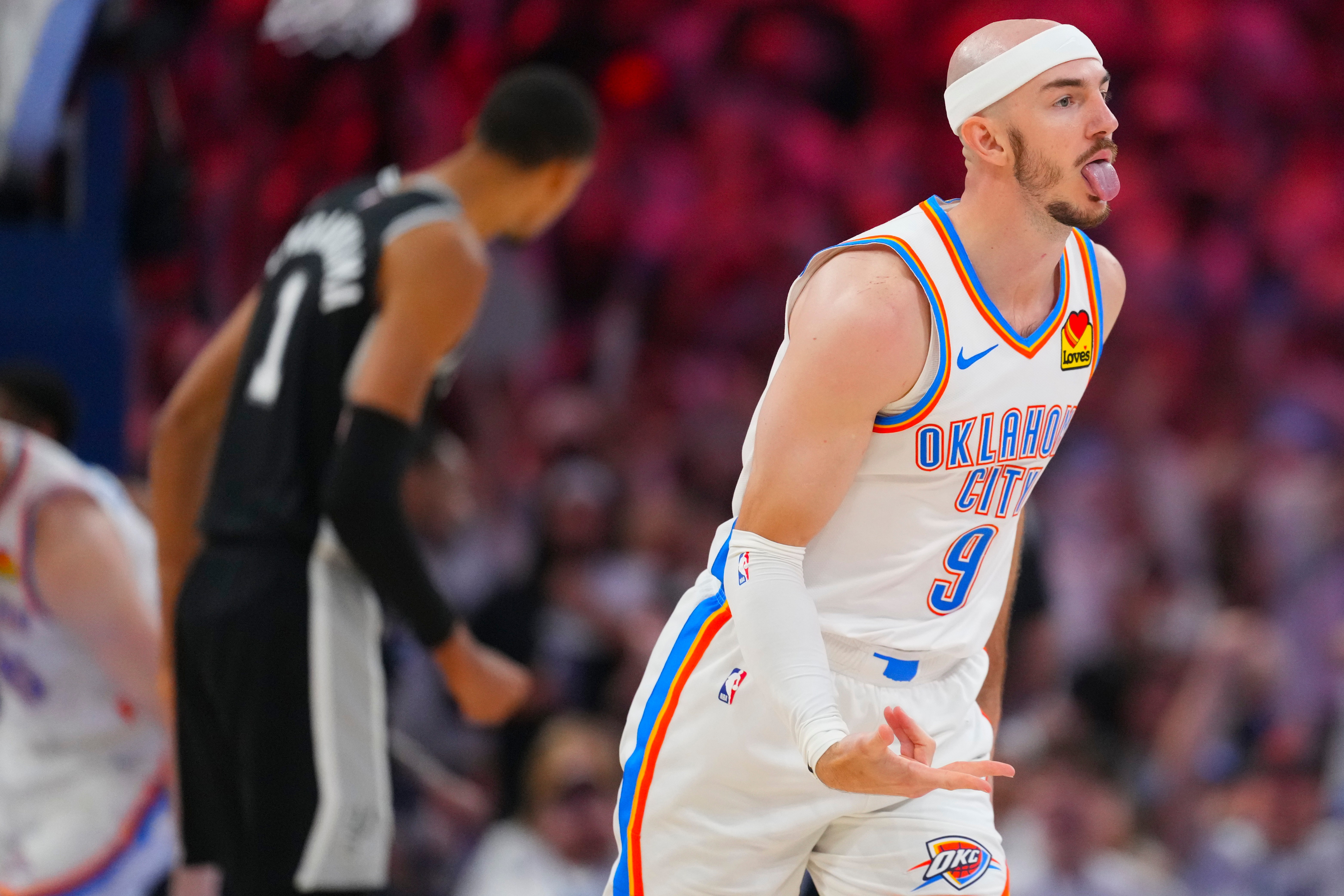 Oklahoma City Thunder guard Alex Caruso (9) celebrates his three-point basket against the San Antonio Spurs in the second half of Game 5 in the Western Conference finals NBA basketball playoffs series, Tuesday, May 26, 2026, in Oklahoma City. (AP Photo/Julio Cortez)
